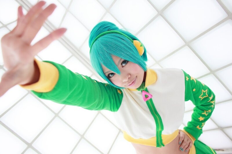 cosplayer with green hair waving