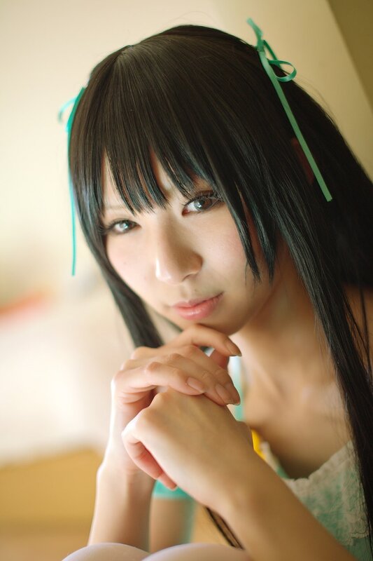 cosplayer with green ribbons