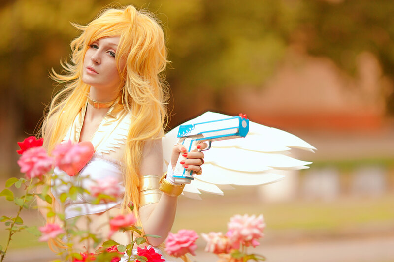 Cosplayer with Gun and Wings
