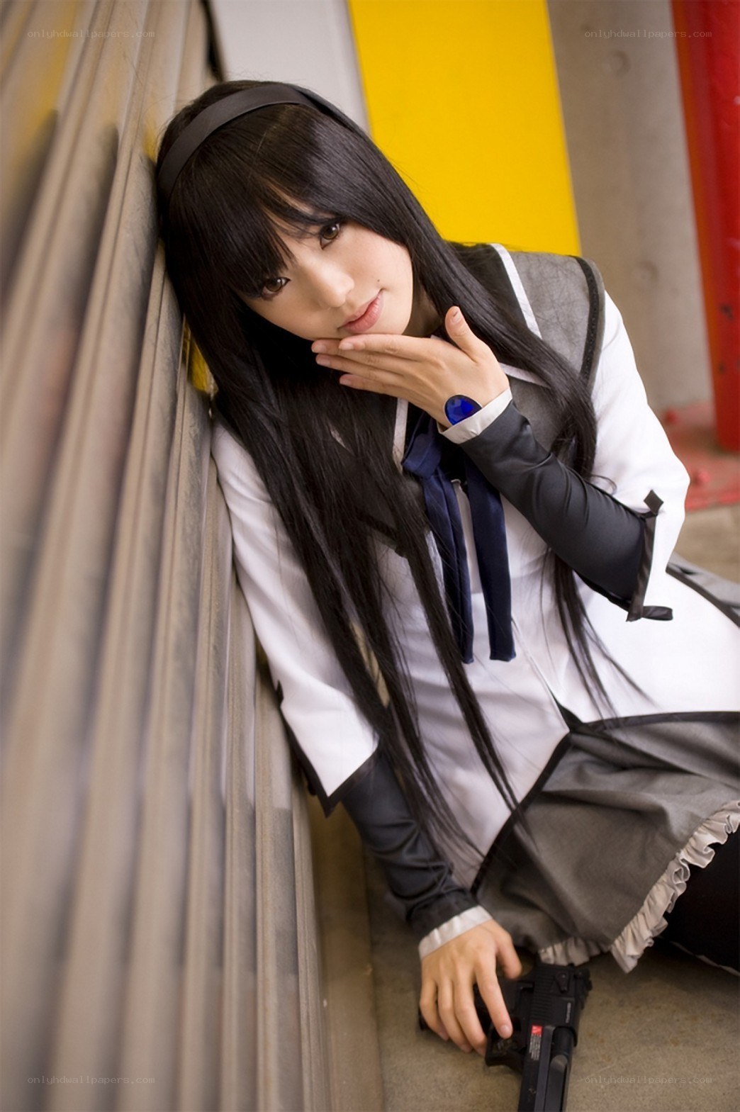 cosplayer with gun in urban setting