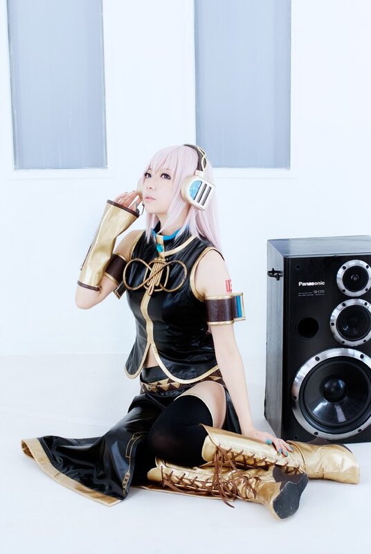 cosplayer with headphones and speaker