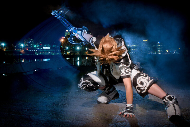 cosplayer with keyblade at night