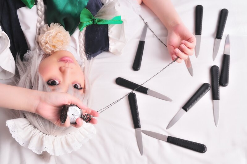 cosplayer with knives and pocket watch