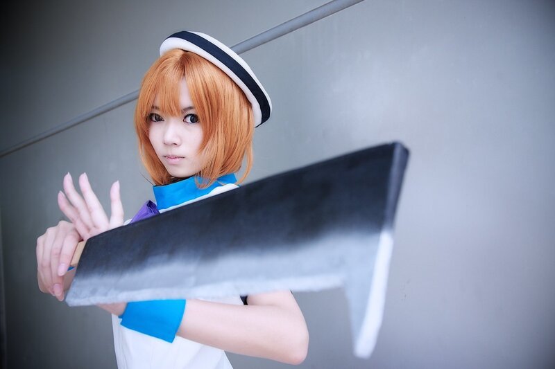 cosplayer with large prop weapon