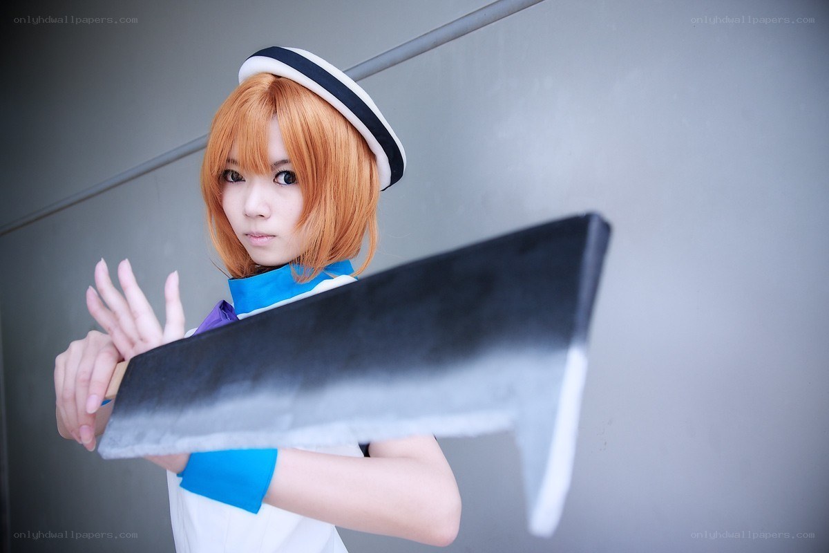 cosplayer with large prop weapon