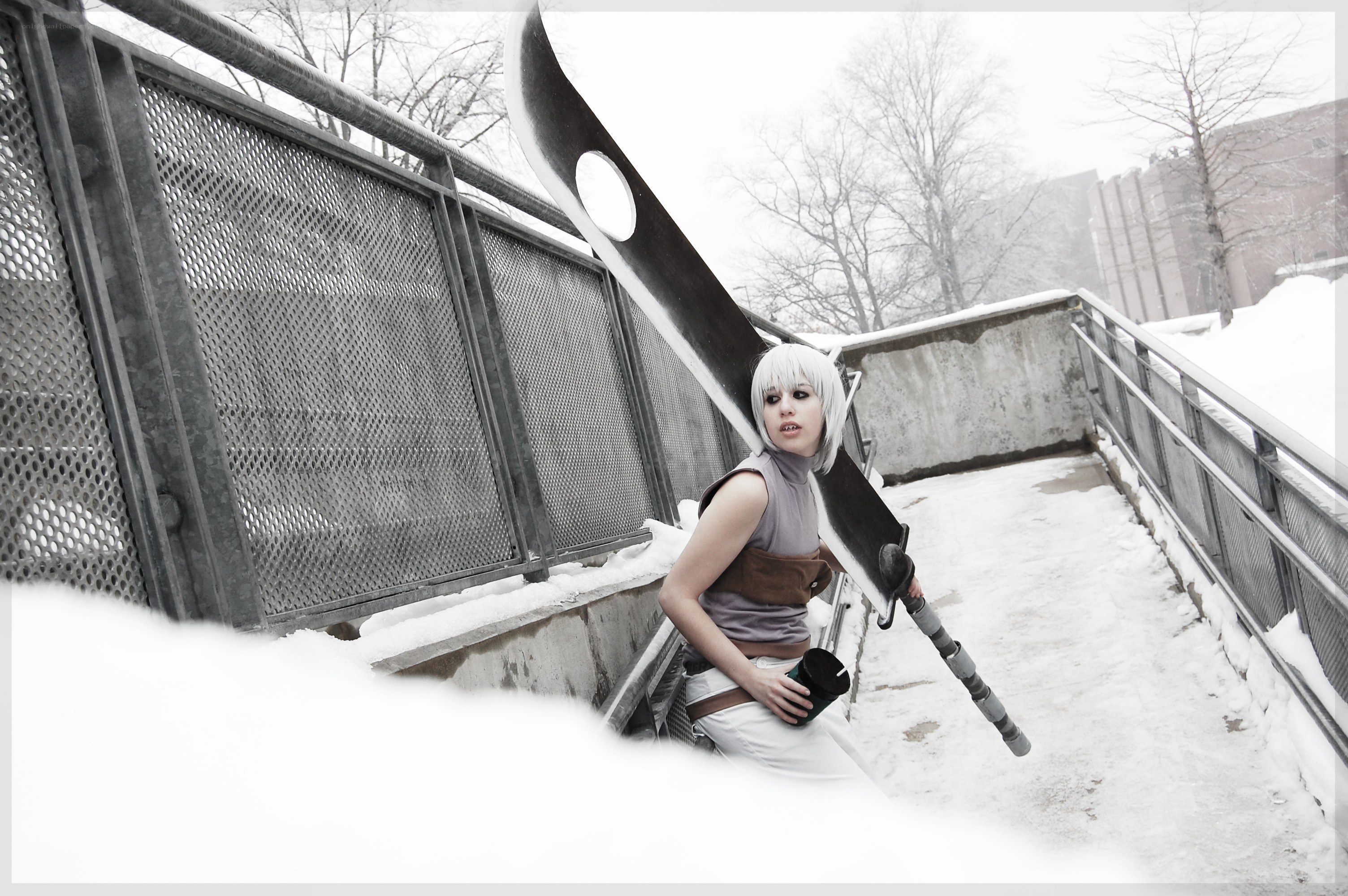 cosplayer with large sword in snow