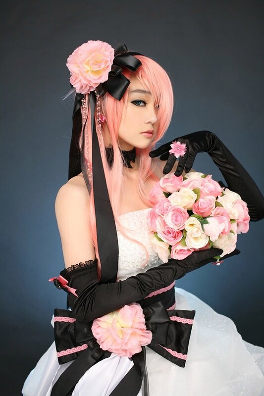 cosplayer with pink hair and flowers