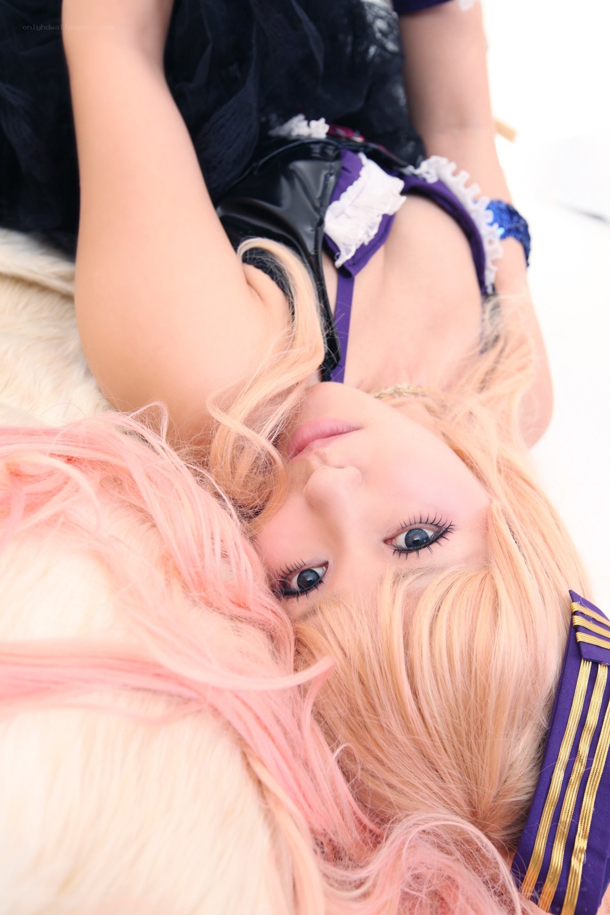 cosplayer with pink hair lying down