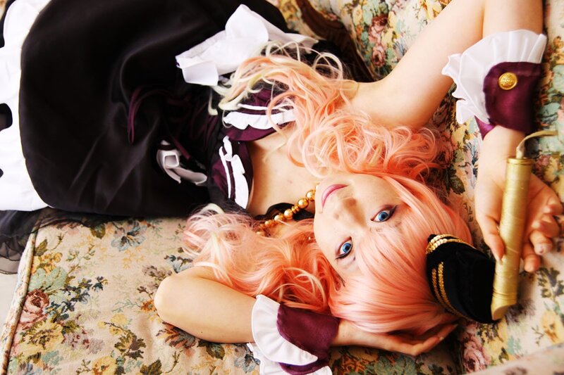 cosplayer with pink hair lying down