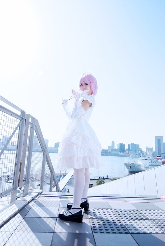 cosplayer with pink hair on rooftop