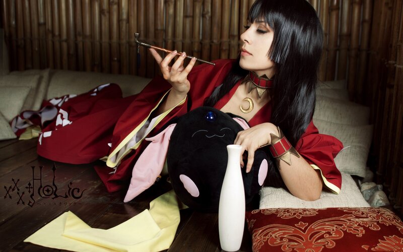 cosplayer with pipe and plush