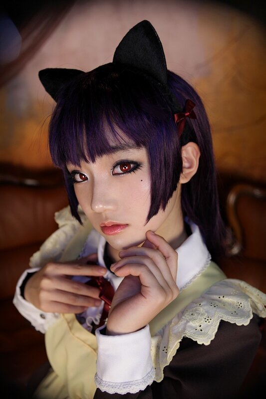 cosplayer with purple hair and cat ears