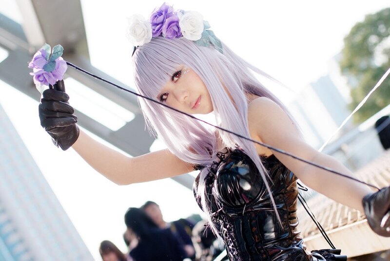 cosplayer with purple hair and flowers