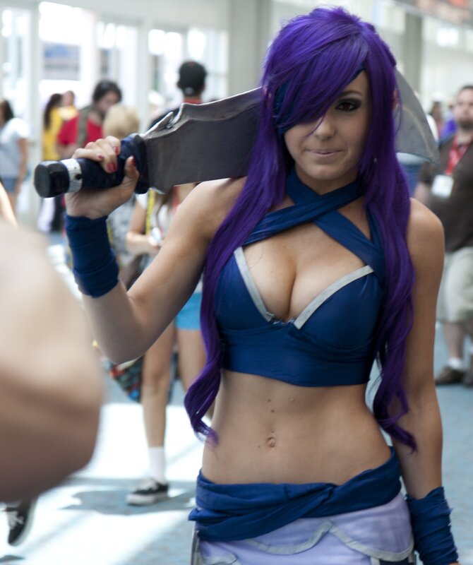 cosplayer with purple hair and sword