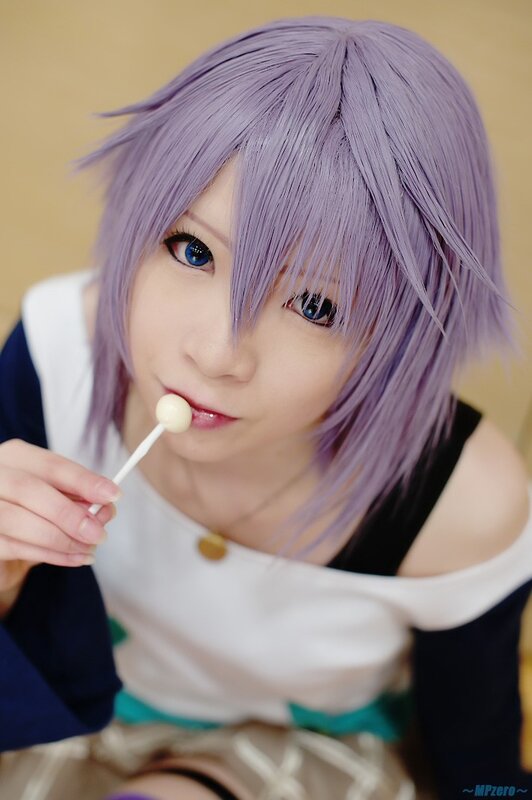 cosplayer with purple hair eating lollipop