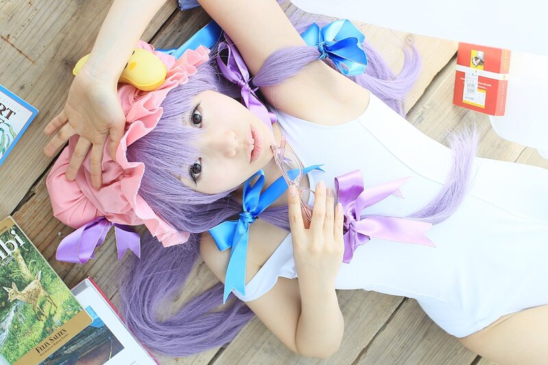 cosplayer with purple hair lying down