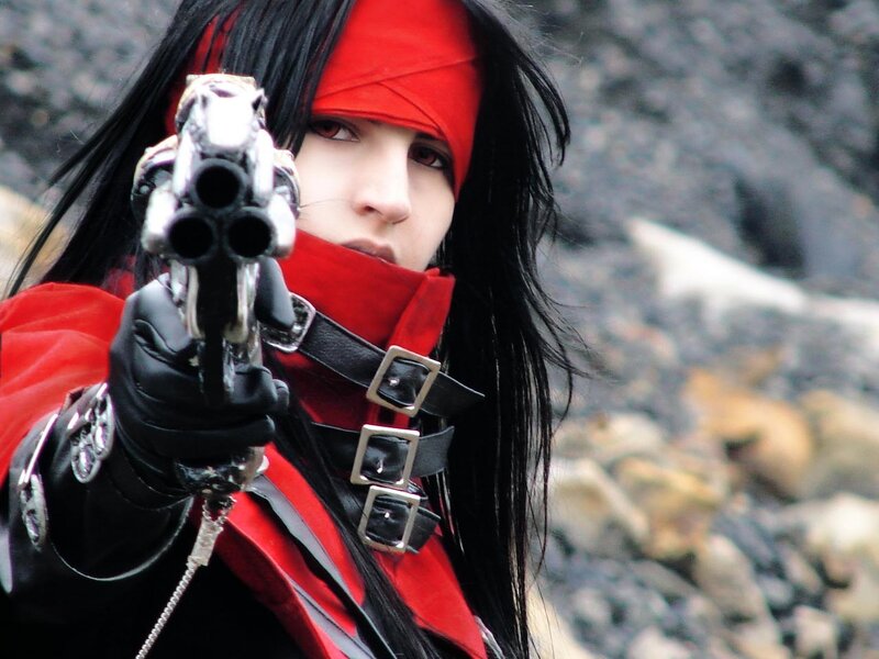 cosplayer with red bandana and gun