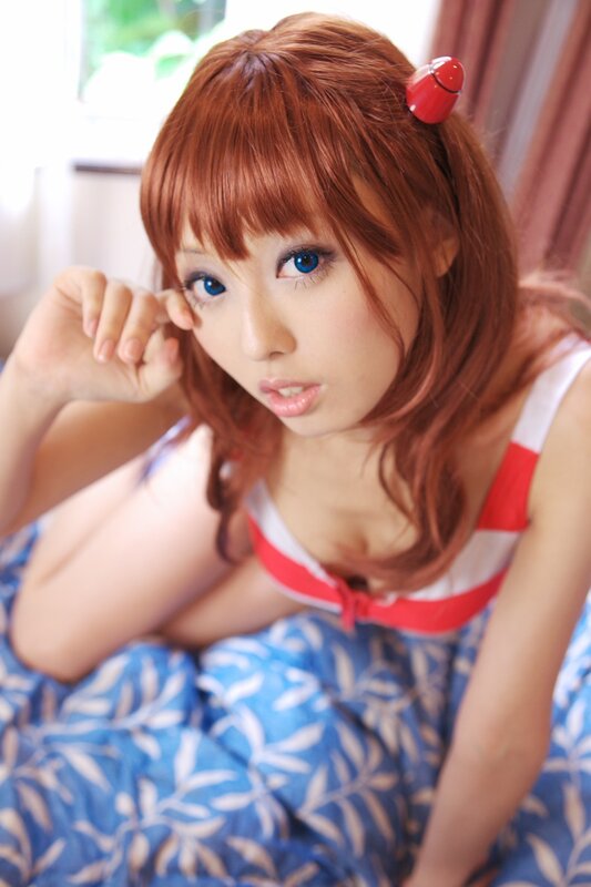 cosplayer with red hair and blue eyes