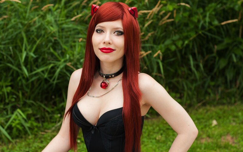 cosplayer with red hair and cat ears