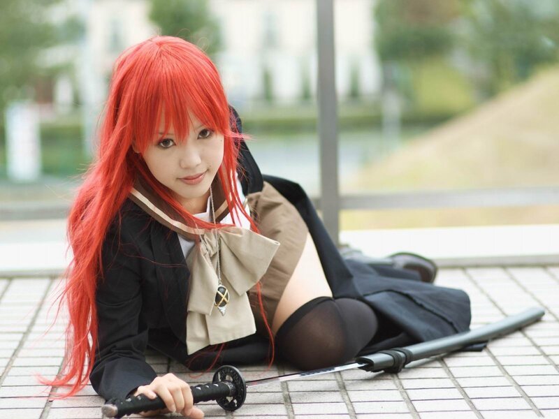 cosplayer with red hair and sword