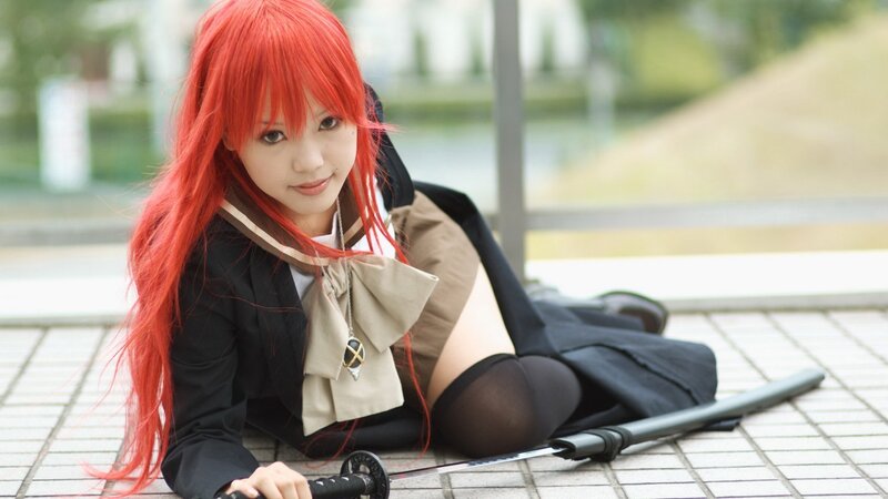 cosplayer with red hair and sword