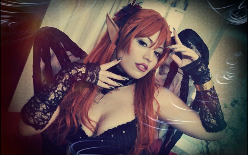 cosplayer with red hair and wings