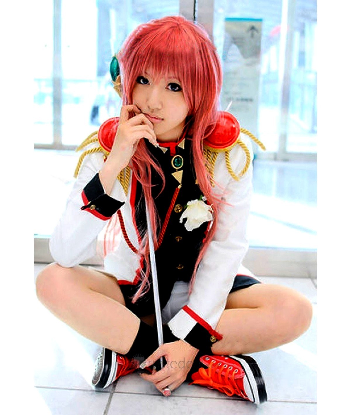 cosplayer with red hair sitting