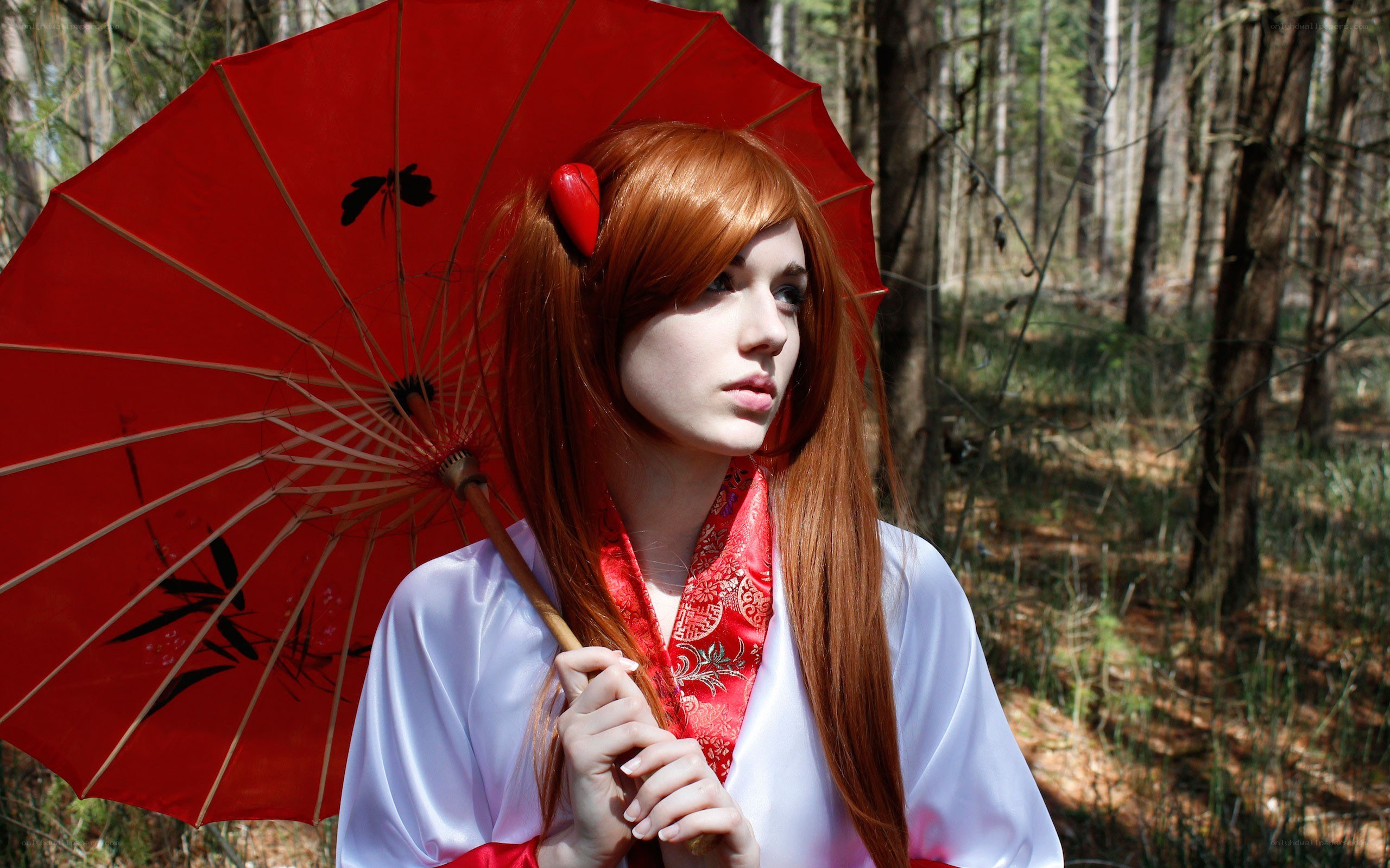 cosplayer with red parasol in forest
