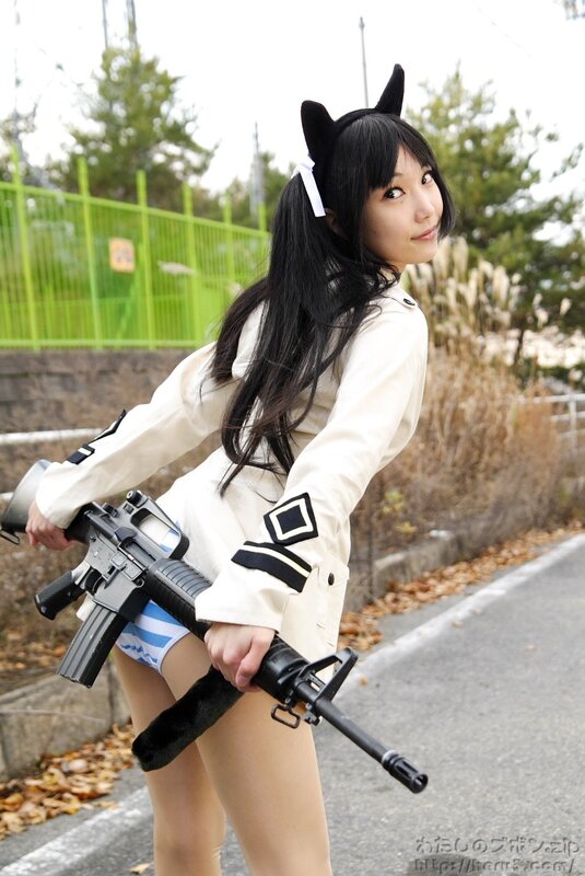cosplayer with rifle outdoors