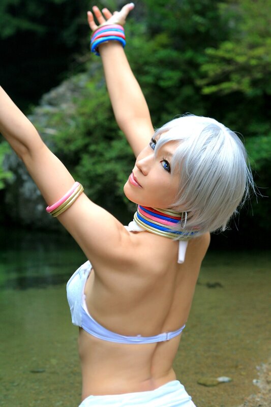 cosplayer with silver hair and colorful accessories