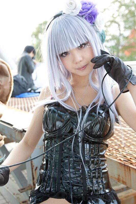 cosplayer with silver hair and corset