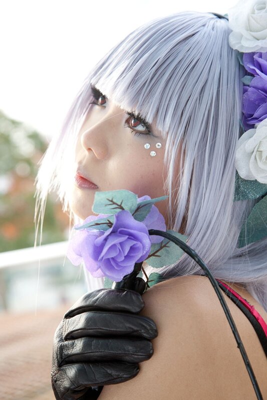 cosplayer with silver hair and flowers