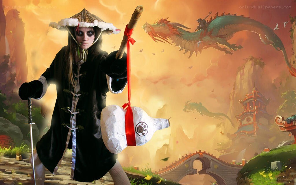 cosplayer with staff and dragon backdrop