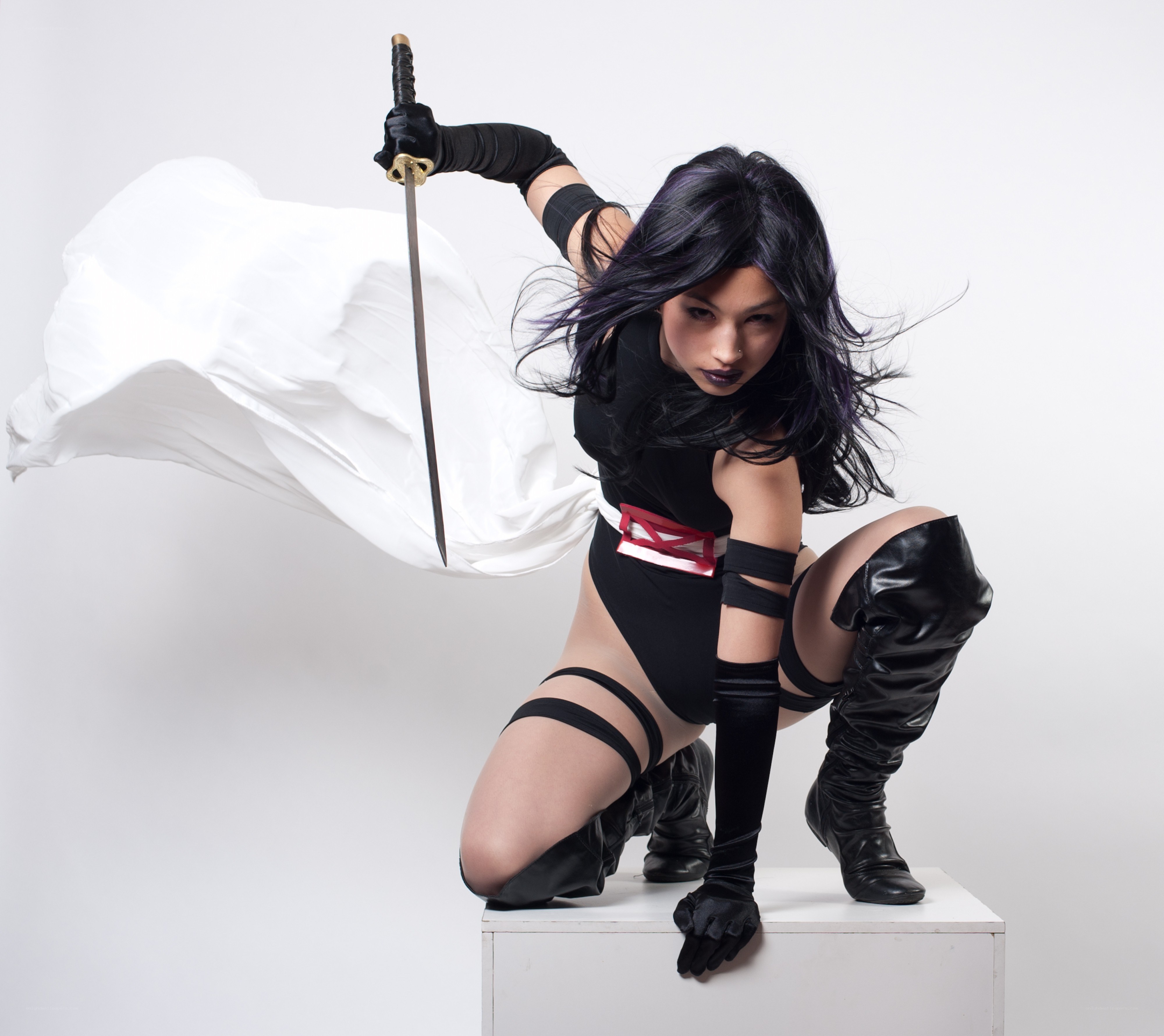 cosplayer with sword and cape