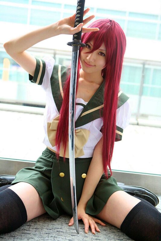 cosplayer with sword and red hair