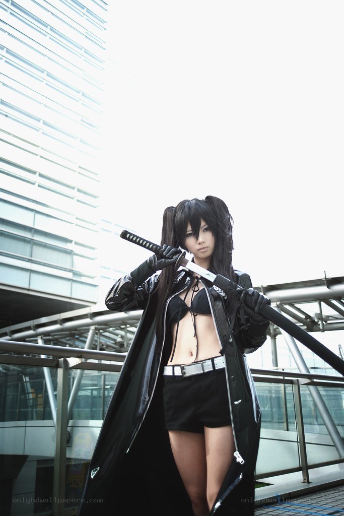 cosplayer with sword in city
