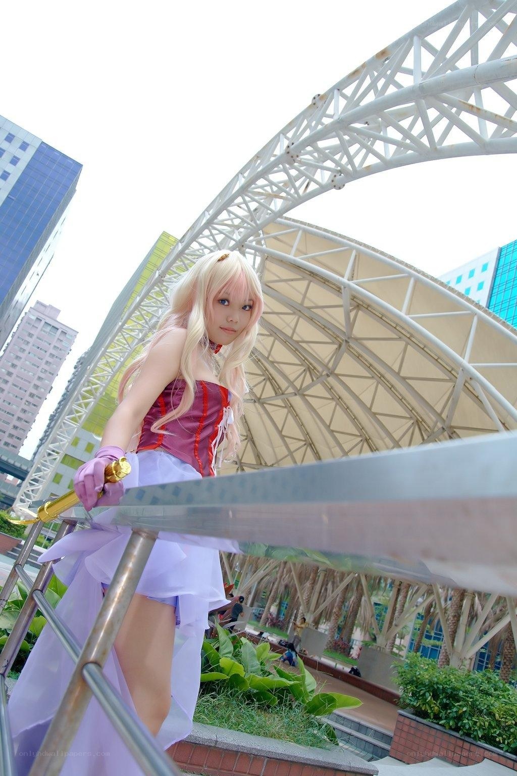 cosplayer with sword in city