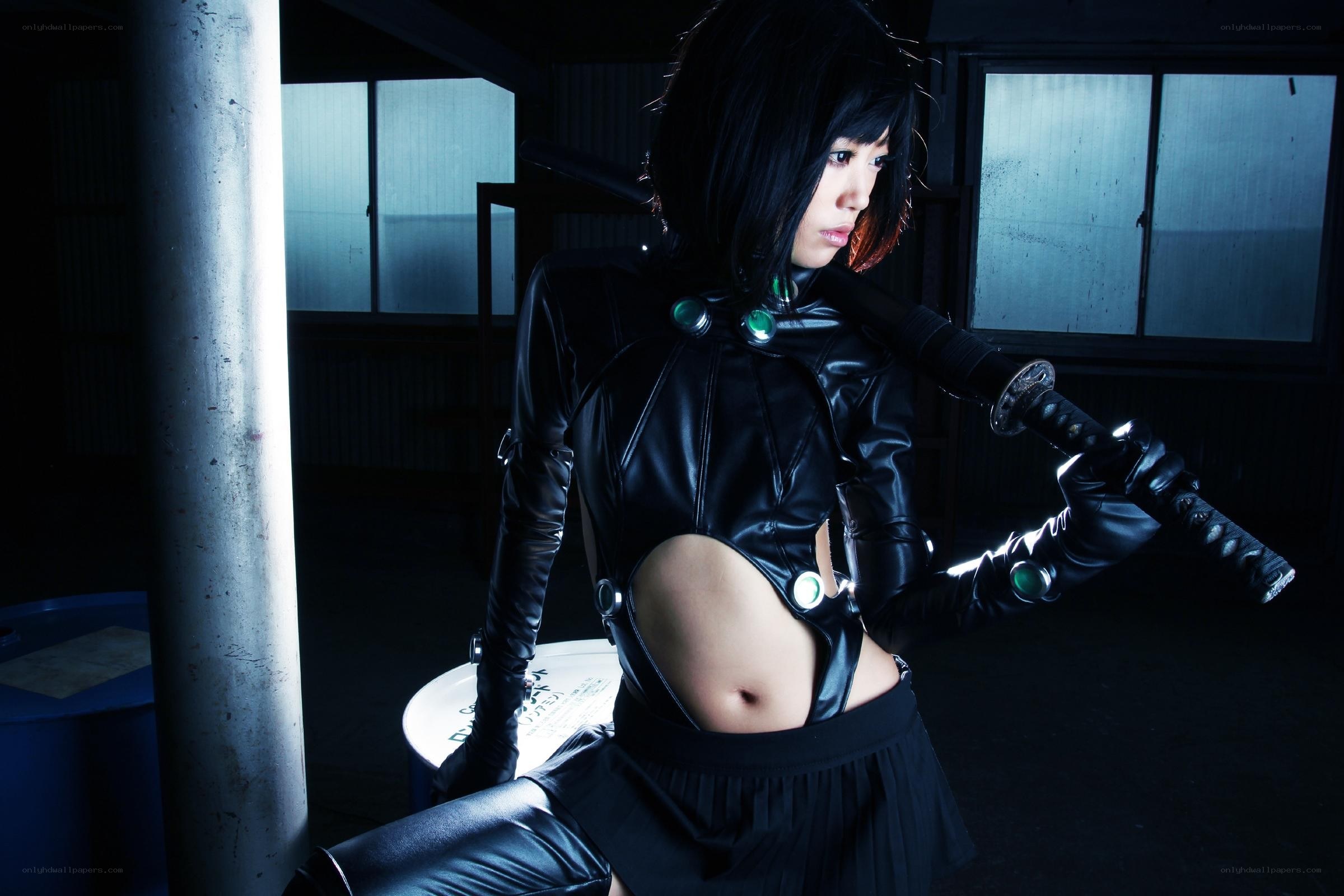 cosplayer with sword in dark room