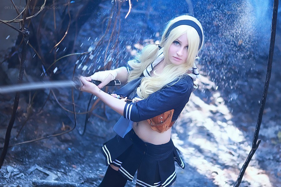 cosplayer with sword in forest