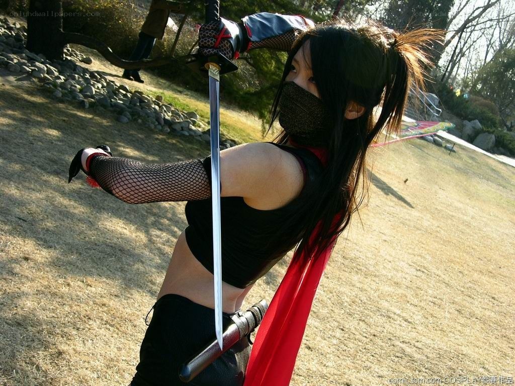 cosplayer with sword in park