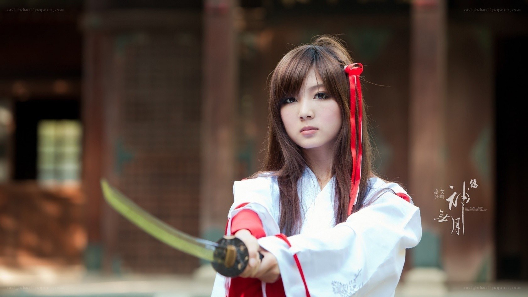 cosplayer with sword in traditional setting