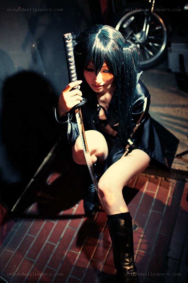 cosplayer with sword on street