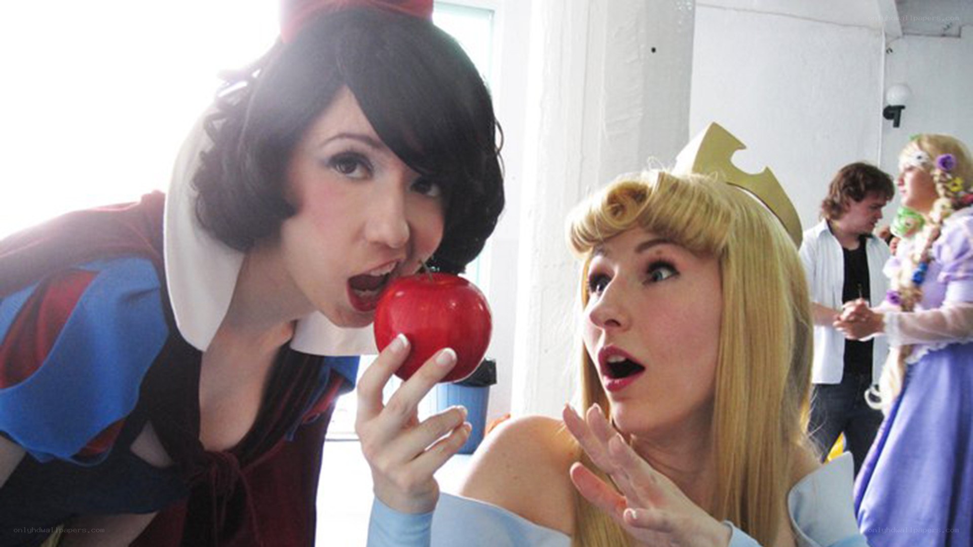 Cosplayers as Snow White and Aurora