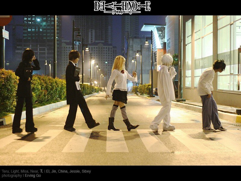 cosplayers crossing street at night
