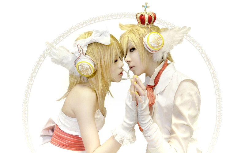 cosplayers in angelic costumes