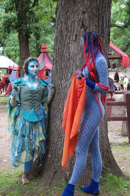 Cosplayers in blue and red costumes