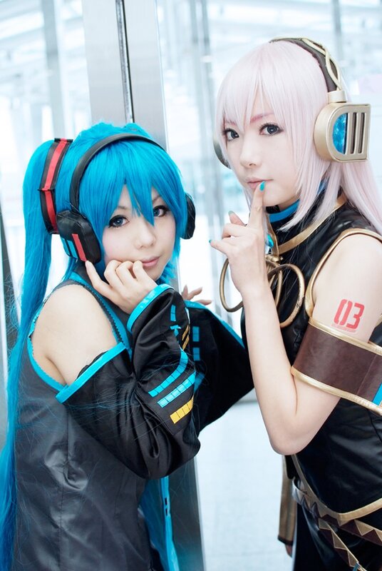 cosplayers in futuristic costumes