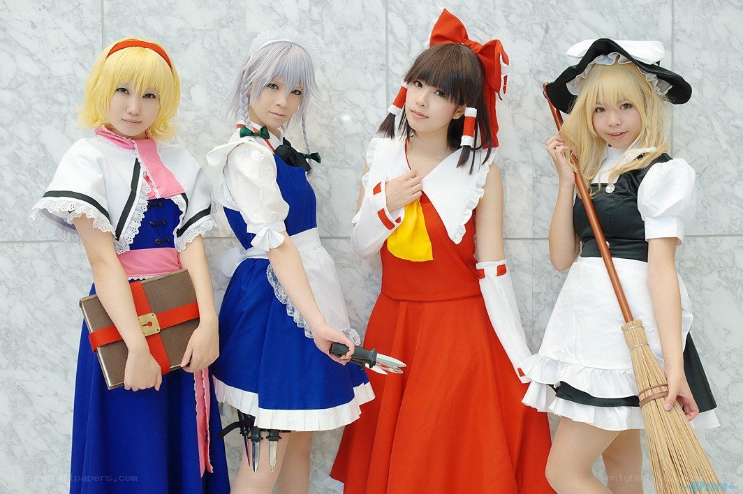 cosplayers in maid costumes