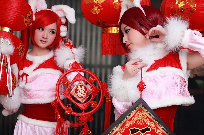 Cosplayers in red and white costumes
