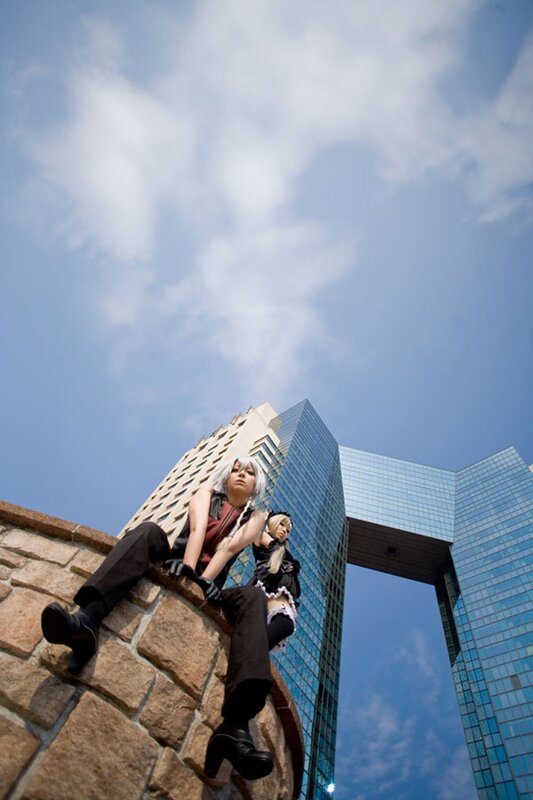Cosplayers on a stone wall